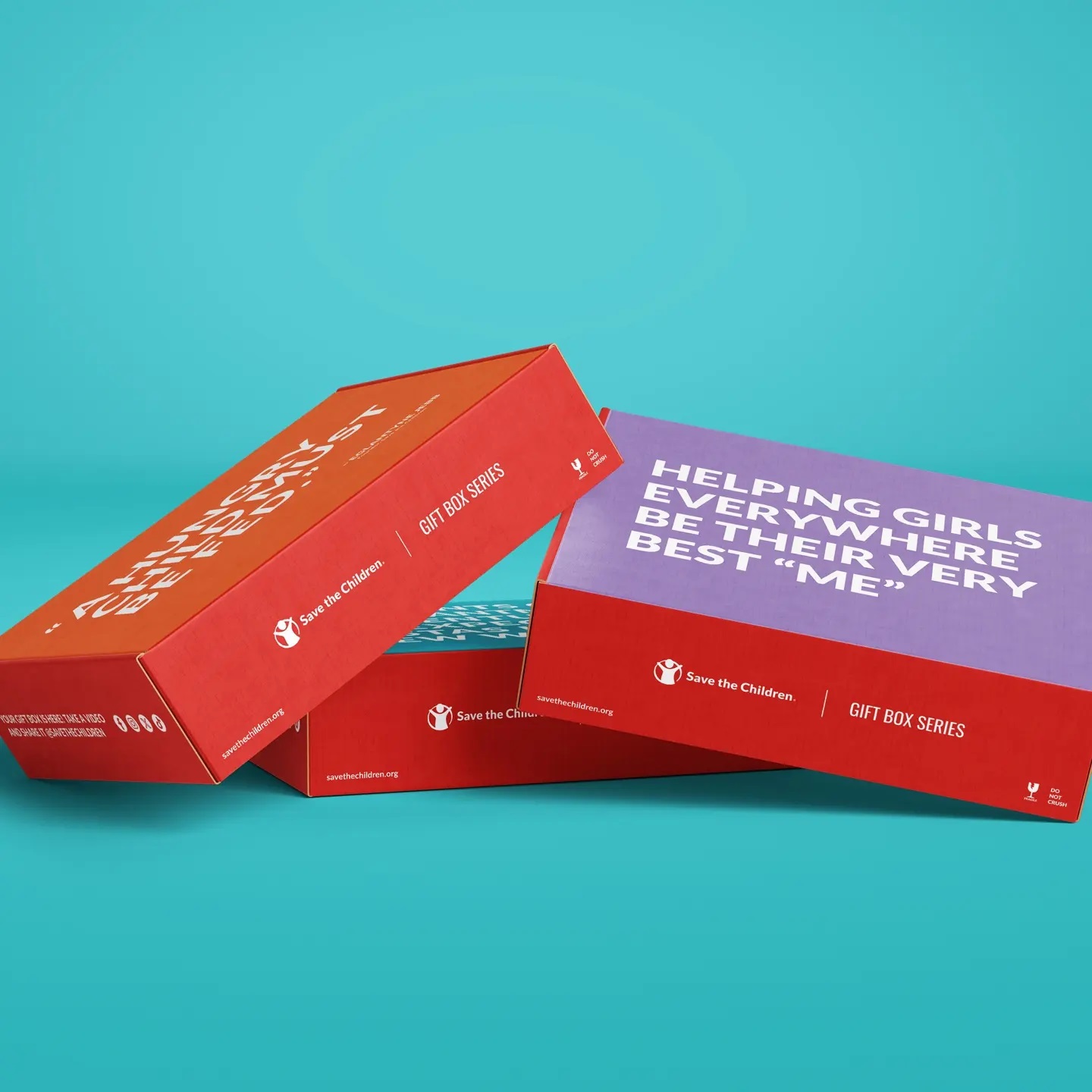 Save the Children Gift Boxes are piled together. 