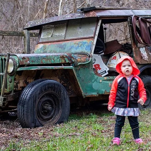 2-year-old Elsa plays in her yard outside of her home in West Virginia.